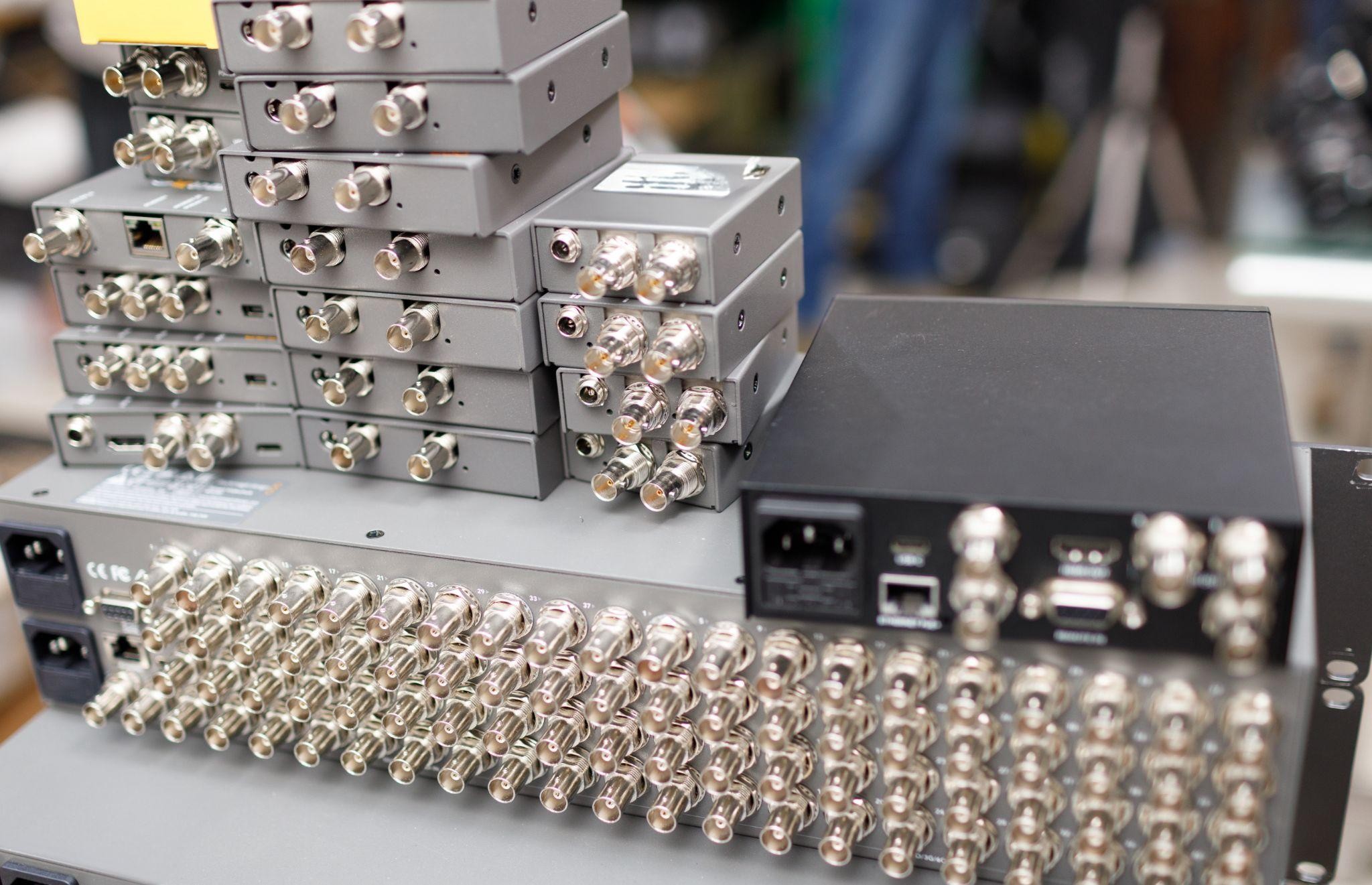 Rack-mounted RF communications equipment with BNC connectors used in defense and broadcast systems